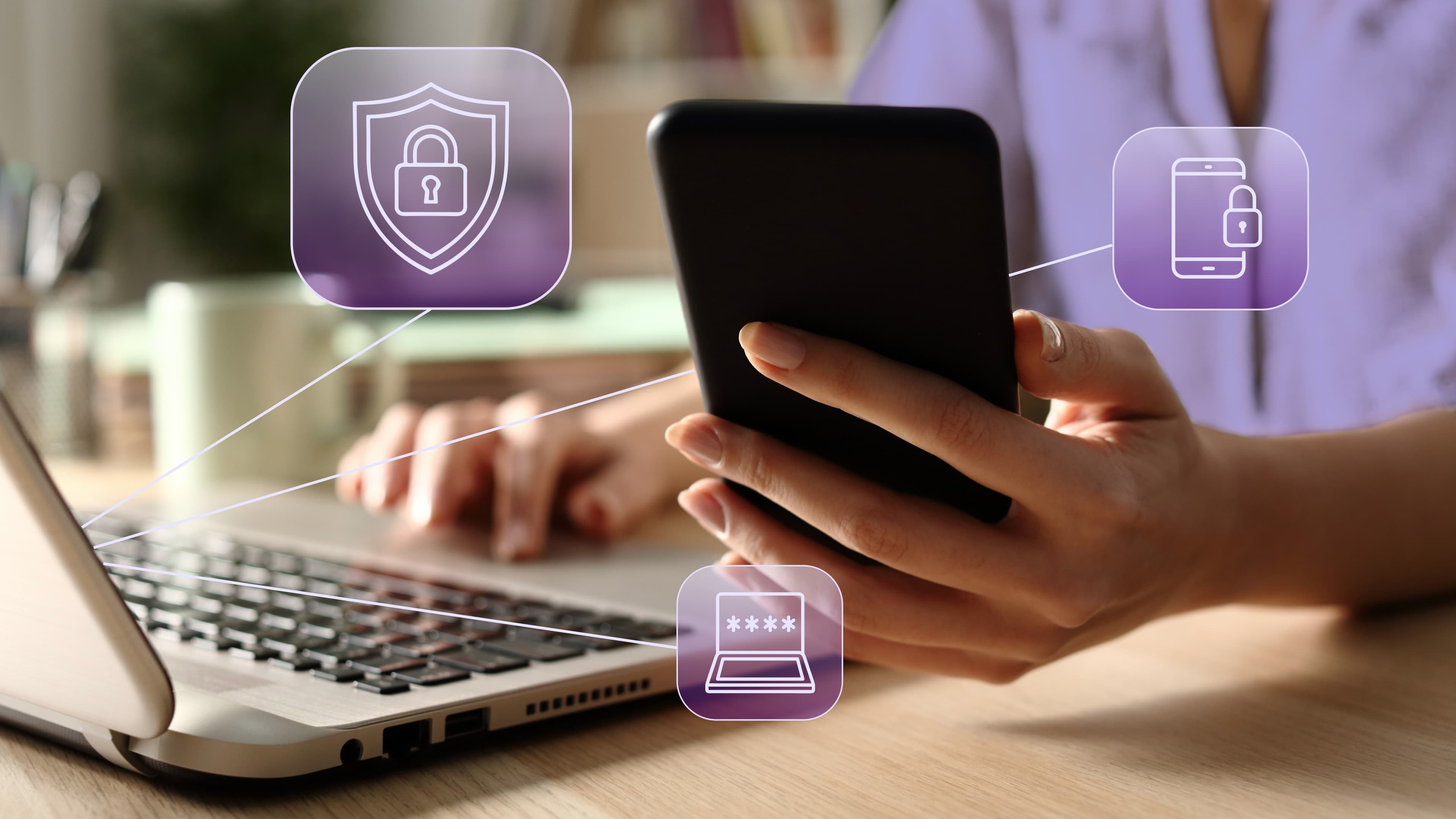 A person taking security precautions while banking with a laptop and a mobile device.